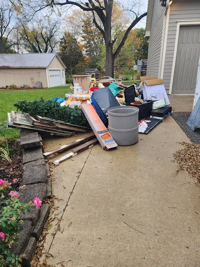 Dumpster being loaded with debris for Roofing Dumpster Rental in Fortuna